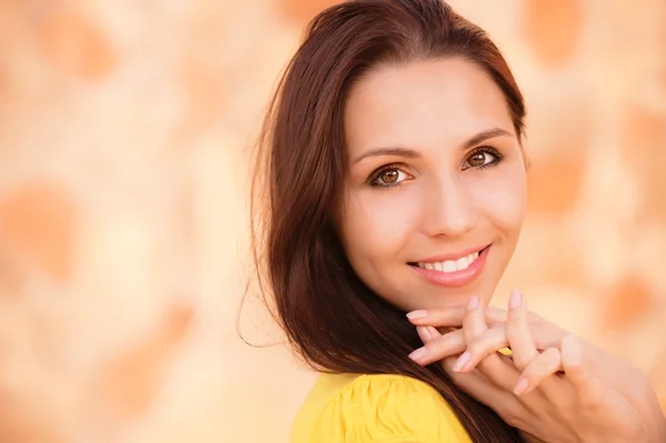 Portrait of smiling girl in yellow clothes — Stock Photo, Image