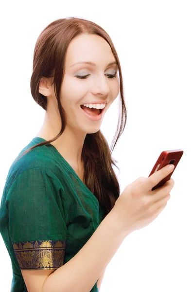 Laughing young woman reads sms — Stock Photo, Image