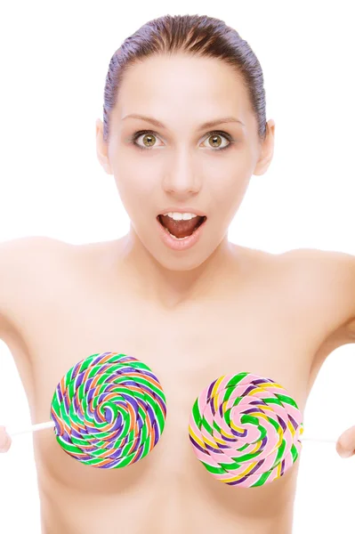 Unawares woman covers breasts with sugar candies — Stock Photo, Image