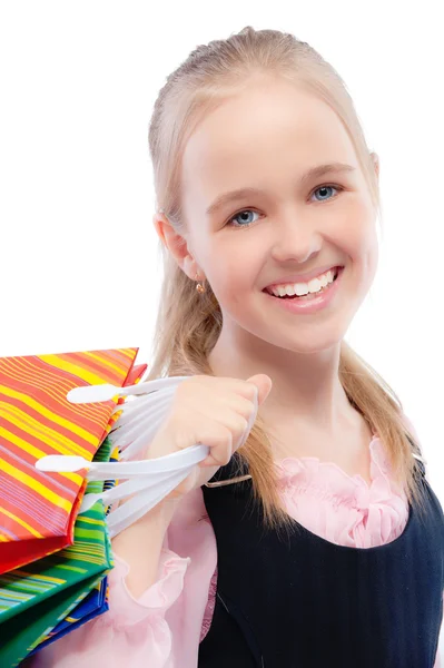 Pequeña chica alegre con compras — Foto de Stock