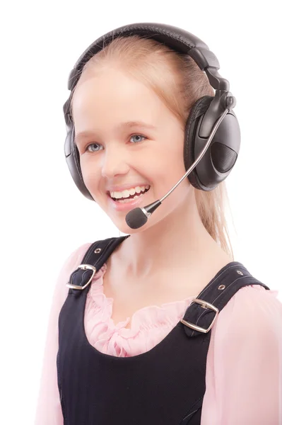 Jonge mooie schoolmeisje met hoofdtelefoon — Stockfoto