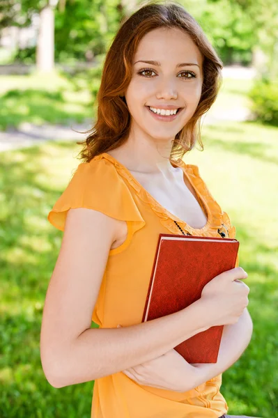 Long-haired girl with book — Stock Photo, Image