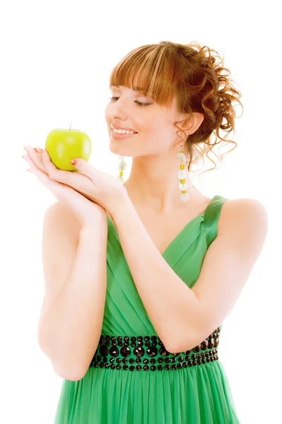 Yeşil elma gülümseyen kız tutar — Stok fotoğraf