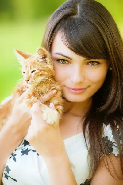Beautiful girl with kitten Stock Photo