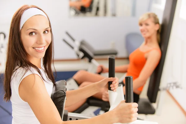 Two beautiful sportwomen make exercise Royalty Free Stock Images