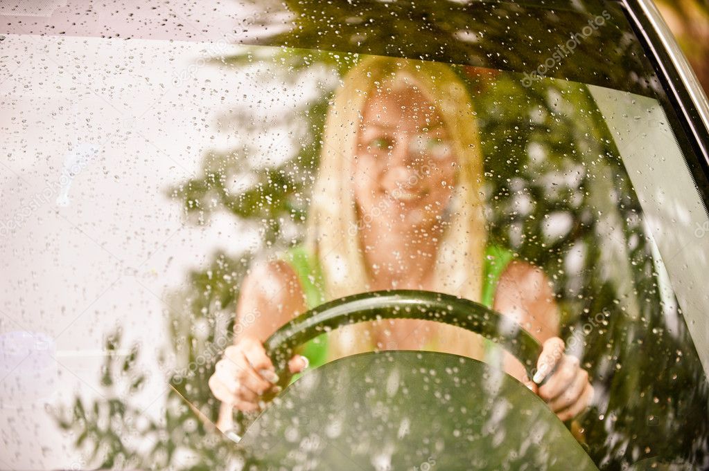 Driver-woman of car at wheel
