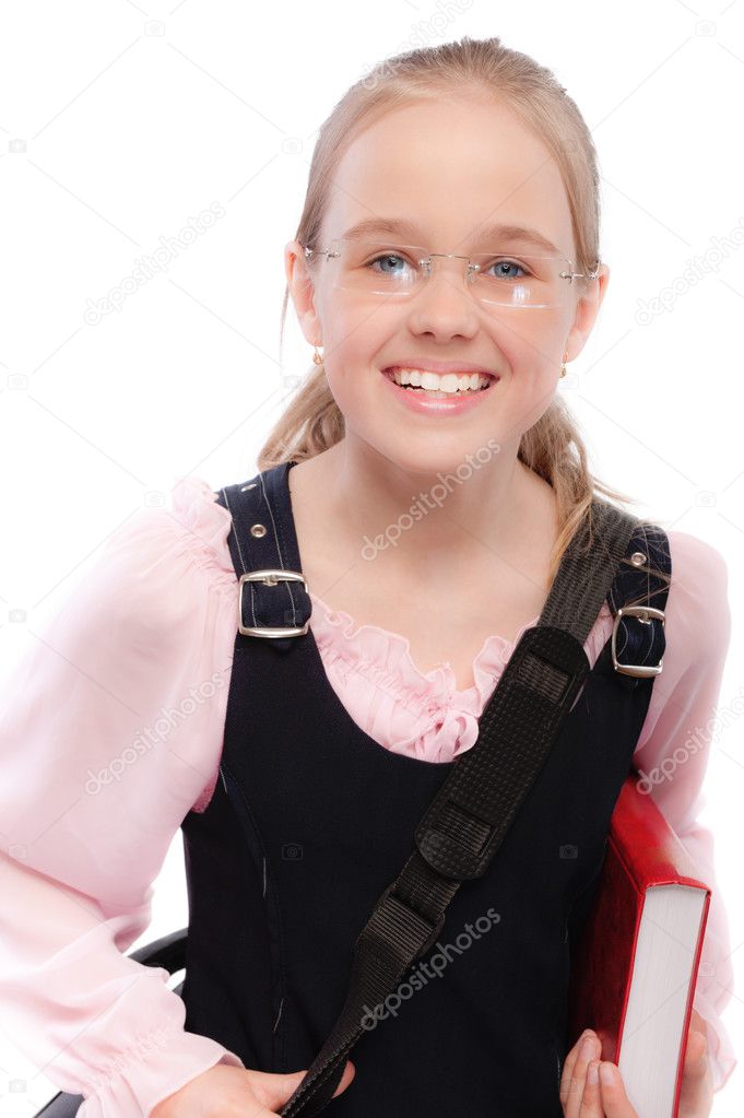 Young smiling schoolgirl holds textbooks