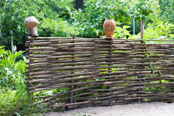 stock image Wattled fence with pots