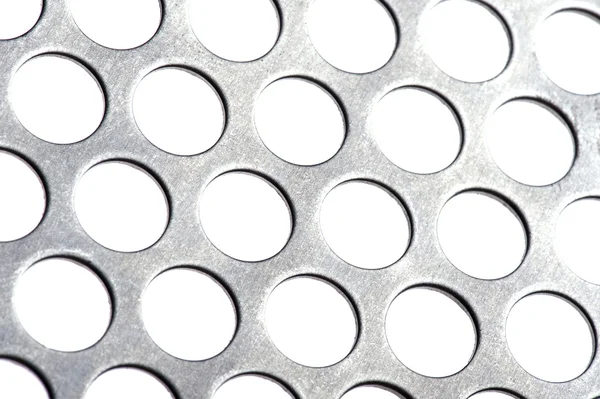Delikli metal üzerinde beyaz izole — Stok fotoğraf