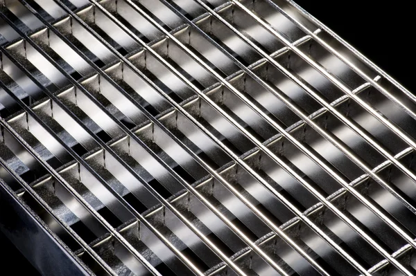 Punched metal on black close up — Stock Photo, Image