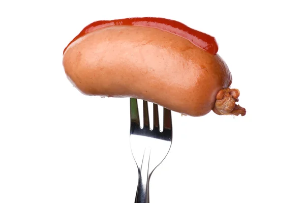 Frankfurter op vork met ketchup — Stockfoto