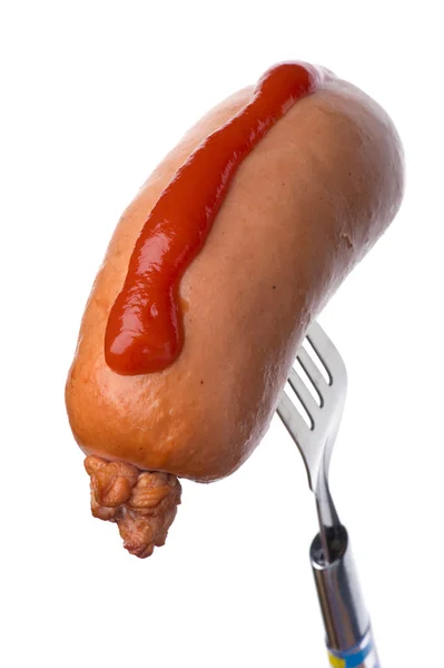 Frankfurter на вилка з кетчупом — стокове фото