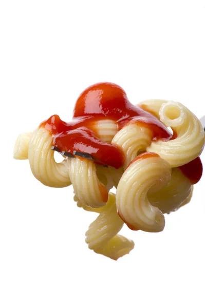 Pasta on fork with ketchup — Stock Photo, Image