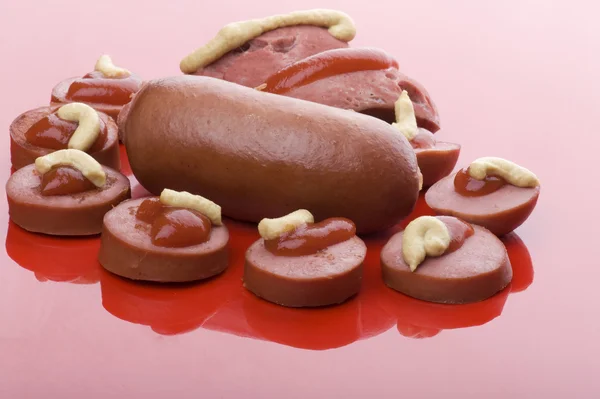 Sausage on red — Stock Photo, Image