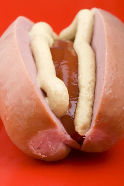 Sausage with ketchup and mustard macro — Stock Photo, Image