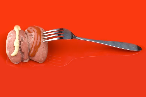 Fork with sausage and ketchup — Stock Photo, Image
