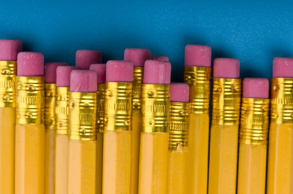 Crayon with eraser on blue macro — Stock Photo, Image