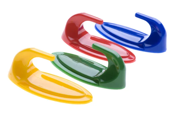 Colored plastic hook on white — Stock Photo, Image