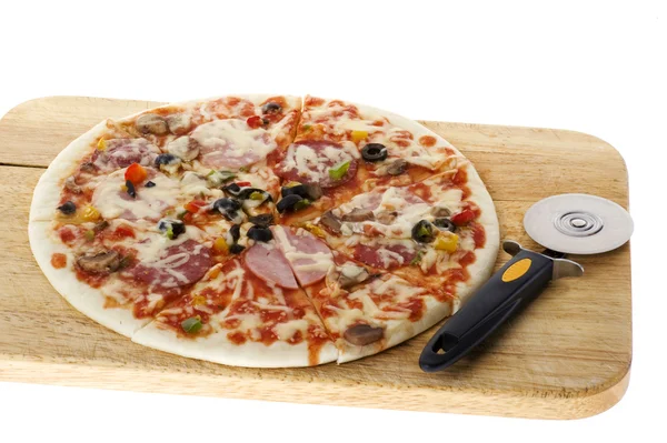 Pizza with knife on white — Stock Photo, Image
