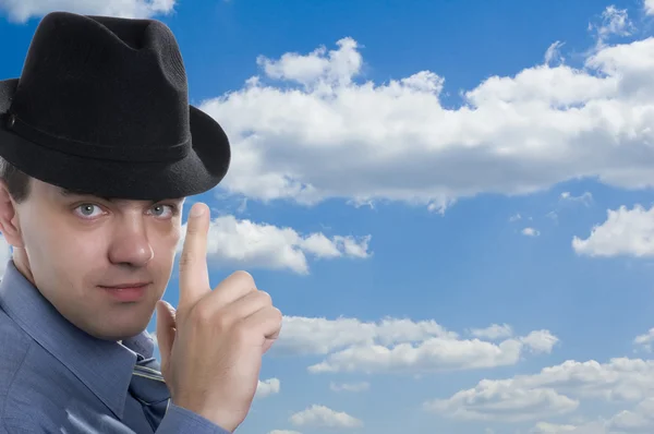 Men in hat on blue sky — Stock Photo, Image