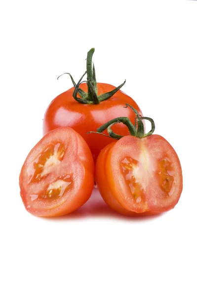 Cutting tomato on white background — Stock Photo, Image