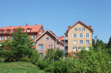 Several low-rise houses clipart