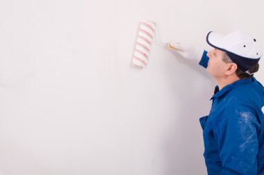 Man painting a wall clipart