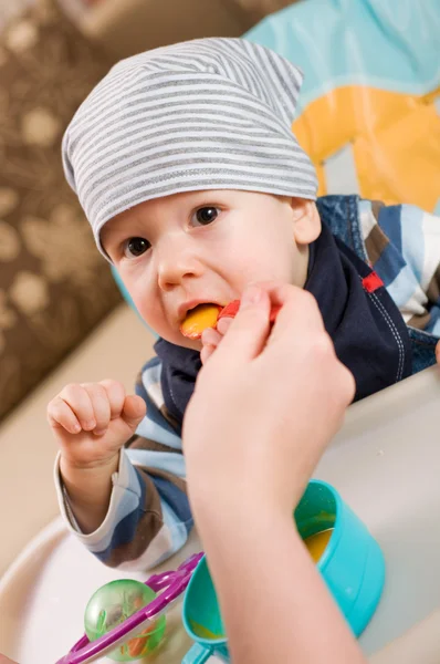Feeding of a small child — Stock Photo, Image