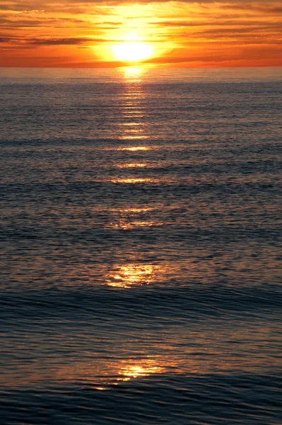 stock image Sunset at coast of the sea