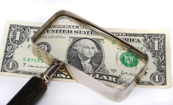 Dollar bill under glaset — Stockfoto