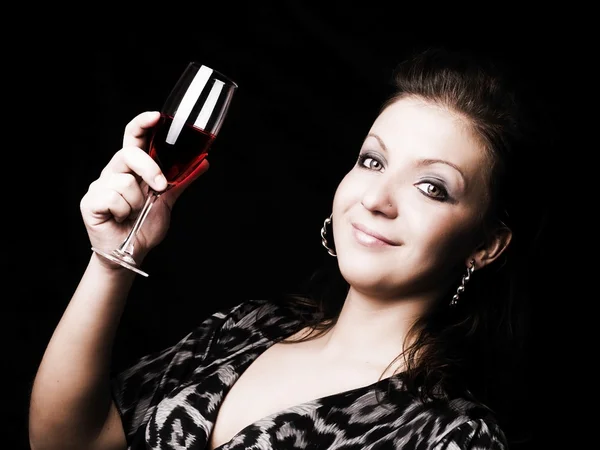 Elegantní žena hospodářství víno — Stock fotografie