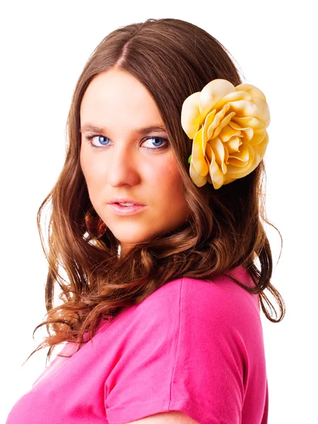 Girl with flower in hair over white — Stock Photo, Image