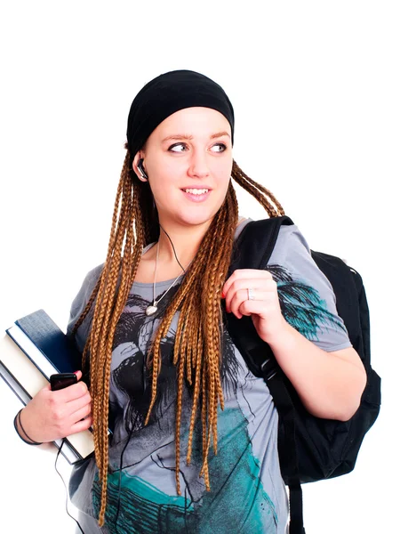 Adolescente estudiante sosteniendo mochila, libros y mirando a la izquierda —  Fotos de Stock