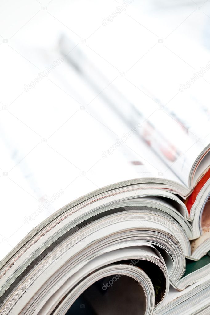 Stack of open colorful magazines - close-up