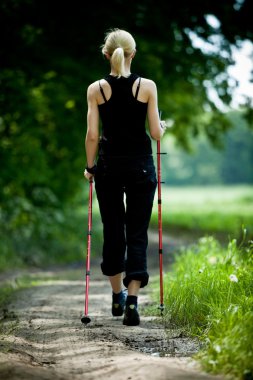 Nordic walking in summer nature clipart