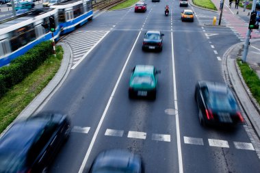 Cars in motion blur on a street of Wroclaw clipart