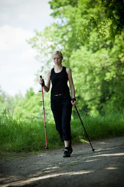 stock image Nordic walking in summer nature - motion blur