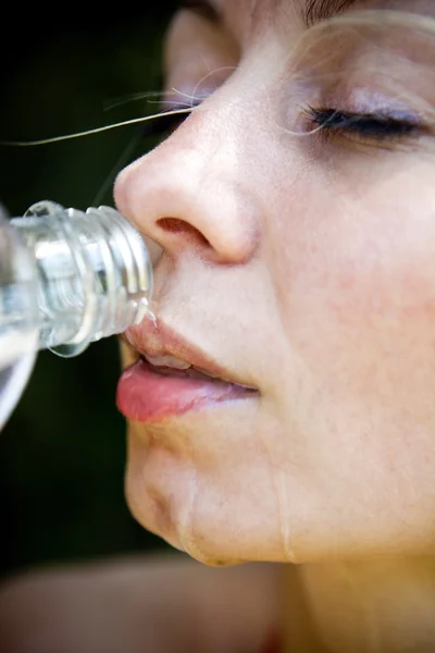 stock image Woman drinking water