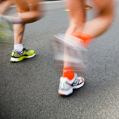 Man running in city marathon - motion blur clipart