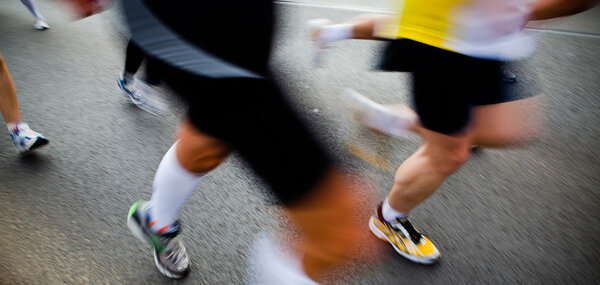 running in city marathon - motion blur