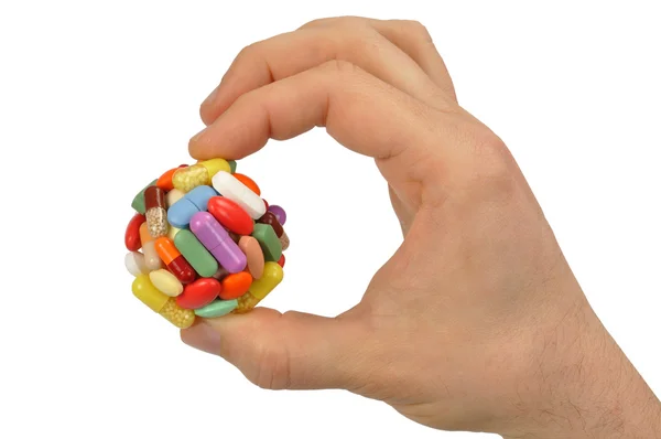 Mano con grande pillola — Foto Stock