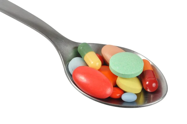Macro de pílulas na colher — Fotografia de Stock