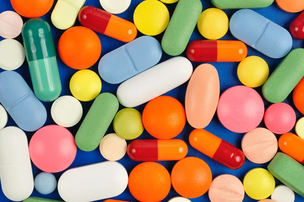 Pílulas em azul — Fotografia de Stock