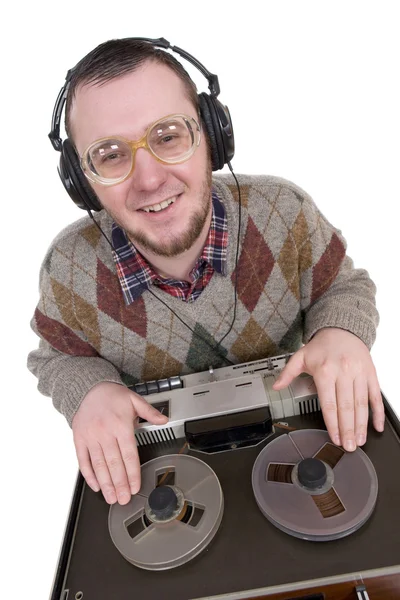 Silly nerd as a dj over white background — Stock Photo, Image