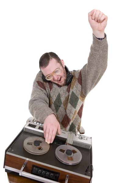 Silly nerd as a dj over white background — Stock Photo, Image