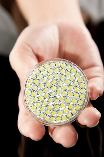 LED lamp in hand — Stockfoto