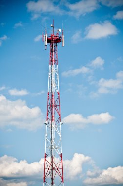 Telecommunication tower on blue sky clipart