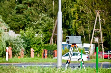Speed camera at the side of the road clipart