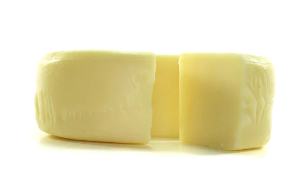 Kaas wiel met een stuk kaas — Stockfoto