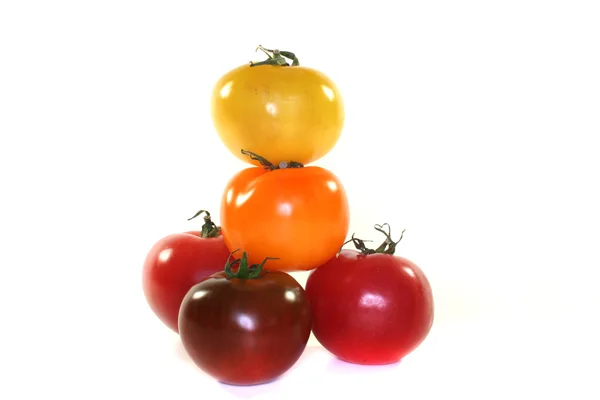 Stacked colorful tomatoes — Stock Photo, Image